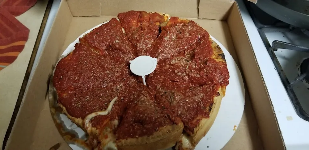 Chicago Style Deep Dish Pizza with Pepperoni Sausage and Extra Cheese